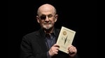 (FILES) Indian-British novelist Salman Rushdie reacts on stage prior to a lecture from his book 'Knife: Meditations After an Attempted Murder', in Berlin on May 16, 2024. The man accused of trying to kill the author Salman Rushdie, leaving him blind in one eye, goes on trial Tuesday February 3, 2025 for attempted murder, according to state court filings. (Photo by Tobias SCHWARZ / AFP) (AFP)