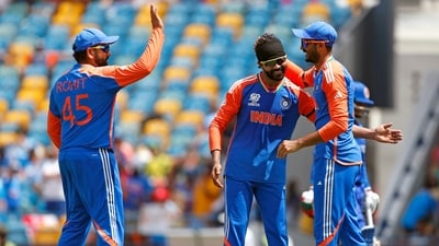 Barbados, Jun 20 (ANI): India's Rohit Sharma (c), Axar Patel and Ravindra Jadeja celebrate the dismissal of Afghanistan's Azmatullah Omarzai during their Super 8 Group 1 match in the ICC Mens T20 World Cup 2024, at Kensington Oval in Barbados on Thursday. (ANI Photo/Surjeet Yadav) (Surjeet Yadav) Barbados, Jun 20 (ANI): India's Rohit Sharma (c), Axar Patel and Ravindra Jadeja celebrate the dismissal of Afghanistan's Azmatullah Omarzai during their Super 8 Group 1 match in the ICC Mens T20 World Cup 2024, at Kensington Oval in Barbados on Thursday. (ANI Photo/Surjeet Yadav) (Surjeet Yadav)