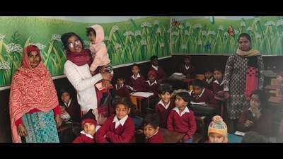 Aditi Sharma with her daughter in one of the classrooms of her school. (HT Photo) Aditi Sharma with her daughter in one of the classrooms of her school. (HT Photo)
