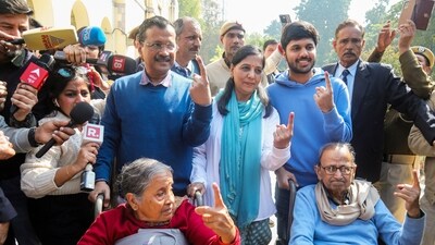 Former Delhi CM and AAP national convenor Arvind Kejriwal with his family after casting his vote at a polling booth during the Delhi Assembly elections, in New Delhi. (PTI) Former Delhi CM and AAP national convenor Arvind Kejriwal with his family after casting his vote at a polling booth during the Delhi Assembly elections, in New Delhi. (PTI)