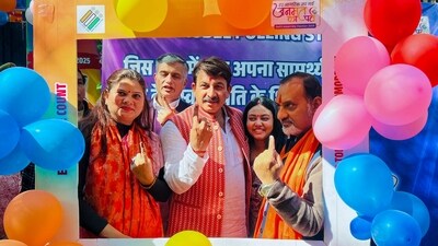 BJP MP Manoj Tiwari displays his inked finger after voting at a polling booth in New Delhi during the Delhi Assembly elections. (@BJP4Delhi) BJP MP Manoj Tiwari displays his inked finger after voting at a polling booth in New Delhi during the Delhi Assembly elections. (@BJP4Delhi)