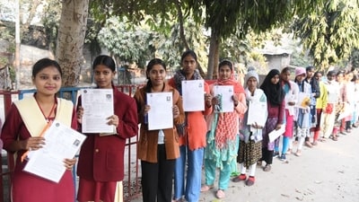 Students wait with their admit cards to appear for the Physics Exam of BSEB Class 12 examinations in Patna (Santosh Kumar) Students wait with their admit cards to appear for the Physics Exam of BSEB Class 12 examinations in Patna (Santosh Kumar)