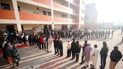 Voters wait in queues to cast their votes for the Delhi Assembly election at Karawal Nagar in New Delhi on February 5. (ANI) Voters wait in queues to cast their votes for the Delhi Assembly election at Karawal Nagar in New Delhi on February 5. (ANI)