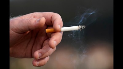 FILE - A man holds a lit cigarette while smoking in San Francisco, Wednesday, Dec. 2, 2020. (AP Photo/Jeff Chiu, File) (AP) FILE - A man holds a lit cigarette while smoking in San Francisco, Wednesday, Dec. 2, 2020. (AP Photo/Jeff Chiu, File) (AP)