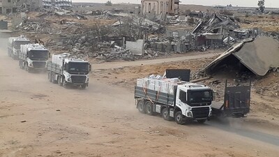 Trucks carrying aid move, amid a ceasefire between Israel and Hamas, in Rafah in the southern Gaza Strip. (REUTERS)