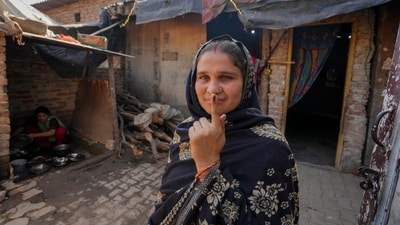 A Pakistani Hindu refugee woman show her finger marked with indelible ink after casting her vote at resettlement colony in Majnu Ka Tila area. (PTI) A Pakistani Hindu refugee woman show her finger marked with indelible ink after casting her vote at resettlement colony in Majnu Ka Tila area. (PTI)