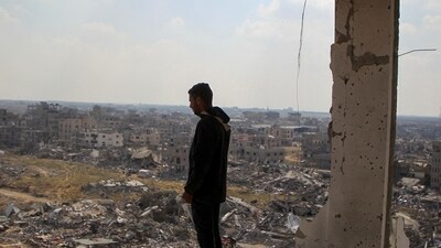 A Palestinian man views the rubble of buildings destroyed during the Israeli offensive, amid a ceasefire between Israel and Hamas, in Rafah in the southern Gaza Strip. (REUTERS)