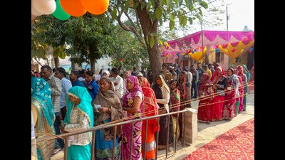 People wait to cast their votes during the Milkipur Assembly by-election on Wednesday (PTI) People wait to cast their votes during the Milkipur Assembly by-election on Wednesday (PTI)