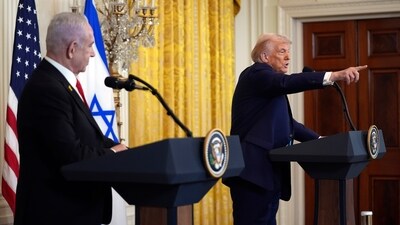 President Donald Trump calls on a reporter for a question as Israel's Prime Minister Benjamin Netanyahu watches during a news conference in the East Room of the White House, Tuesday, Feb. 4, 2025, in Washington. (AP Photo/Evan Vucci) (AP) President Donald Trump calls on a reporter for a question as Israel's Prime Minister Benjamin Netanyahu watches during a news conference in the East Room of the White House, Tuesday, Feb. 4, 2025, in Washington. (AP Photo/Evan Vucci) (AP)