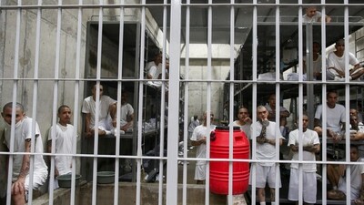 Inmates remain in their cell during a tour in the "Terrorism Confinement Center" (CECOT) complex, which according to El Salvador's President, Nayib Bukele, is designed to hold 40,000 inmates, in Tecoluca, El Salvador October 12, 2023. REUTERS/Jose Cabezas/File Photo (REUTERS)