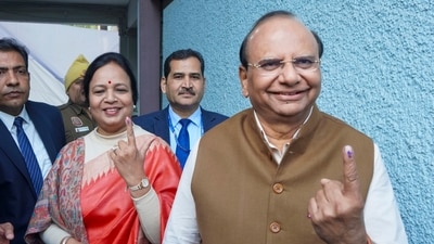 Delhi LG VK Saxena cast his vote at a polling booth in Civil Lines, New Delhi, and displayed his inked finger. (PTI) Delhi LG VK Saxena cast his vote at a polling booth in Civil Lines, New Delhi, and displayed his inked finger. (PTI)