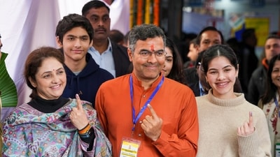 BJP candidate Parvesh Sahib Singh Verma, accompanied by his family, cast his vote at a polling booth in New Delhi on Wednesday during the Delhi Assembly elections. Verma, son of former CM Sahib Singh Verma, is contesting from the New Delhi constituency against AAP chief Arvind Kejriwal and Congress leader Sandeep Dikshit, son of former CM Sheila Dikshit. (PTI) BJP candidate Parvesh Sahib Singh Verma, accompanied by his family, cast his vote at a polling booth in New Delhi on Wednesday during the Delhi Assembly elections. Verma, son of former CM Sahib Singh Verma, is contesting from the New Delhi constituency against AAP chief Arvind Kejriwal and Congress leader Sandeep Dikshit, son of former CM Sheila Dikshit. (PTI)