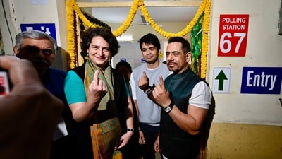 Congress MP Priyanka Gandhi Vadra, accompanied by her husband Robert Vadra and son Rehan Vadra, shows her inked finger after casting their votes in the Delhi Assembly election at Nirman Bhawan. (HT photo/Raj K Raj) Congress MP Priyanka Gandhi Vadra, accompanied by her husband Robert Vadra and son Rehan Vadra, shows her inked finger after casting their votes in the Delhi Assembly election at Nirman Bhawan. (HT photo/Raj K Raj)