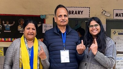 AAP leader Satyendar Jain, accompanied by his family, cast his vote at a polling booth in New Delhi. (@SatyendarJain) AAP leader Satyendar Jain, accompanied by his family, cast his vote at a polling booth in New Delhi. (@SatyendarJain)