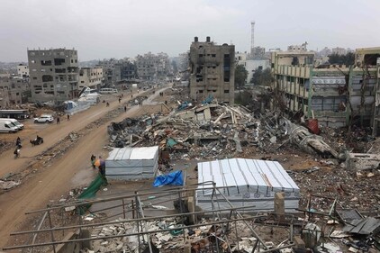 People walk amid collapsed buildings along Saftawi street in Jabalia in the northern Gaza Strip on February 5, 2025 during a ceasefire deal in the war between Israel and Hamas went into effect. (AFP) People walk amid collapsed buildings along Saftawi street in Jabalia in the northern Gaza Strip on February 5, 2025 during a ceasefire deal in the war between Israel and Hamas went into effect. (AFP)