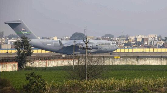 The US military aircraft carrying illegal Indian immigrants at the Shri Guru Ramdas Ji International Airport in Amritsar on Wednesday afternoon. (PTI Photo)