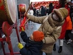 A woman and child beat a drum at a carnival during a national holiday on the sixth day of the Lunar New Year in Beijing. China’s Lunar Holiday travel boom: Why locals are skipping flights for road and rail! A woman and child beat a drum at a carnival during a national holiday on the sixth day of the Lunar New Year in Beijing. China’s Lunar Holiday travel boom: Why locals are skipping flights for road and rail!