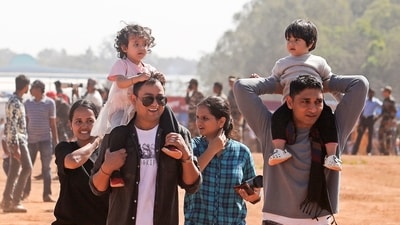 People gather to watch the final rehearsal for Aero India 2025, at Yelahanka Air Force Station, in Bengaluru. (PTI)