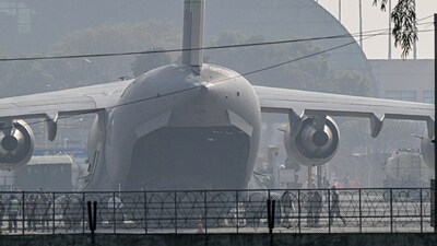 A US Air Force C-17 Globemaster III aircraft carrying undocumented Indian migrants deported by the US at Sri Guru Ram Dass Jee International Airport in Amritsar, Punjab (Bloomberg)