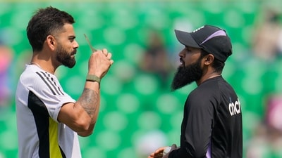 England's Adil Rashid, right, speaks to India's Virat Kohli before the start of the first ODI. (AP) England's Adil Rashid, right, speaks to India's Virat Kohli before the start of the first ODI. (AP)