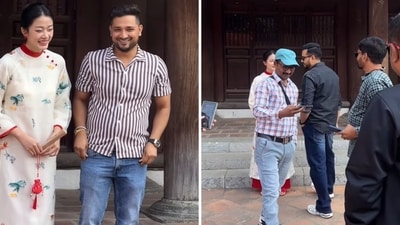 A group of men posing with a Vietnamese woman dressed in Ao Dai. (Screengrab (TikTok)) A group of men posing with a Vietnamese woman dressed in Ao Dai. (Screengrab (TikTok))