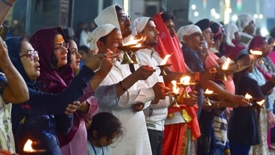 Devotees at a 'Ganga Aarti' on the bank of the River Ganga during the ongoing Maha kumbh Mela, in Prayagraj (PTI) Devotees at a 'Ganga Aarti' on the bank of the River Ganga during the ongoing Maha kumbh Mela, in Prayagraj (PTI)