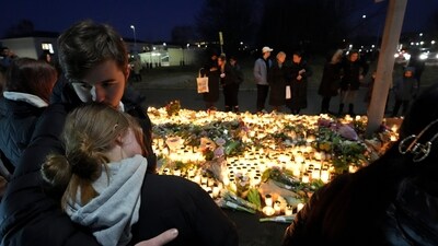 People take part in a vigil near the scene of a shooting at an adult education center on the outskirts of Orebro, Sweden, Thursday, Feb. 6, 2025. (AP Photo/Sergei Grits) People take part in a vigil near the scene of a shooting at an adult education center on the outskirts of Orebro, Sweden, Thursday, Feb. 6, 2025. (AP Photo/Sergei Grits)