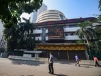 Sensex, Nifty 50 down: People look at the digital screen on the facade of BSE building in Mumbai. Sensex, Nifty 50 down: People look at the digital screen on the facade of BSE building in Mumbai.