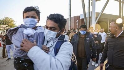 Deportees from Gujarat at the Ahmedabad airport on Thursday. (PTI) Deportees from Gujarat at the Ahmedabad airport on Thursday. (PTI)