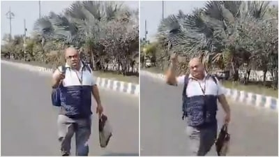 Amit Kumar Sarkar was seen in a viral video walking through city streets with a blood-stained knife. (X) Amit Kumar Sarkar was seen in a viral video walking through city streets with a blood-stained knife. (X)