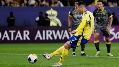 Al Nassr's Cristiano Ronaldo scores their second goal from the penalty spot vs Al Wasl in the Asian Champions League. (REUTERS)