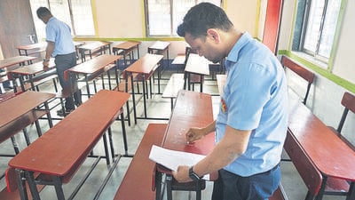 Thane, India - February 07, 2025: It is seen preparing for the HSC 12th exam which starts on 11th February Tuesday An employee is seen writing the exam seat number on a bench in a college in Thane ,in Thane,in Mumbai, India, on, Friday, February -07, 2024. ( Praful Gangurde /HT Photo ) Thane, India - February 07, 2025: It is seen preparing for the HSC 12th exam which starts on 11th February Tuesday An employee is seen writing the exam seat number on a bench in a college in Thane ,in Thane,in Mumbai, India, on, Friday, February -07, 2024. ( Praful Gangurde /HT Photo )