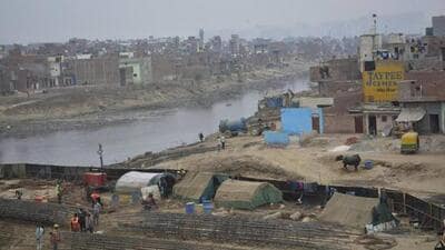 The district administration has been issuing warnings against the illegal establishments on the floodplains and issuing a fresh warning on Friday, that if any illegal construction is being carried out in these areas, it must be removed immediately. (HT Photo) The district administration has been issuing warnings against the illegal establishments on the floodplains and issuing a fresh warning on Friday, that if any illegal construction is being carried out in these areas, it must be removed immediately. (HT Photo)