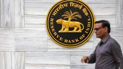The logo for Reserve Bank of India (RBI) at the central bank's headquarters building in Mumbai, India, on Friday. India's new central bank governor cut interest rates for the first time in almost five years. (Bloomberg) The logo for Reserve Bank of India (RBI) at the central bank's headquarters building in Mumbai, India, on Friday. India's new central bank governor cut interest rates for the first time in almost five years. (Bloomberg)