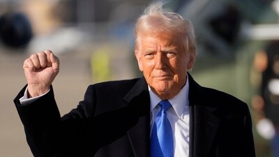 President Donald Trump gestures as he walks to board Air Force One at Joint Base Andrews, Md., Friday, Feb. 7, 2025, en route to his Mar-a-Lago estate in Palm Beach, Fla. (AP Photo/Ben Curtis)