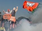 Supporters of the Bharatiya Janata Party celebrate as BJP leads in vote counting for the Delhi legislative assembly election outside the party's headquarters in New Delhi on February 8, 2025. 
