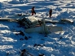 This photo provided by the US Coast Guard on Friday, Feb. 7, 2025, shows a small commuter plane that crashed in western Alaska on a flight that was bound for the hub community of Nome.