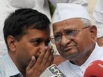 In this Sunday, June 5, 2011 photo, Arvind Kejriwal speaks to social activist Anna Hazare in New Delhi. 