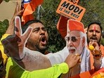 Supporters of the BJP celebrate as BJP leads in vote counting for the Delhi legislative assembly election outside the party's state headquarters in New Delhi on February 8, 2025. 
