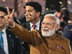 Prime Minister Narendra Modi flashes victory sign as he arrives at the Bharatiya Janata Party (BJP) headquarters to celebrate the party's win in the Delhi legislative assembly election.