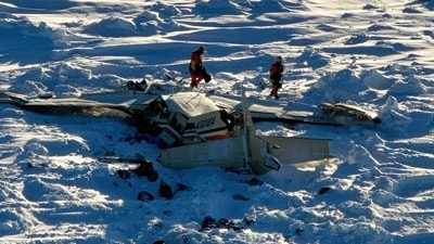 This photo provided by the U.S. Coast Guard on Friday, Feb. 7, 2025, shows a small commuter plane that crashed in western Alaska on a flight that was bound for the hub community of Nome. AP/PTI(AP02_08_2025_000008A) (AP) This photo provided by the U.S. Coast Guard on Friday, Feb. 7, 2025, shows a small commuter plane that crashed in western Alaska on a flight that was bound for the hub community of Nome. AP/PTI(AP02_08_2025_000008A) (AP)