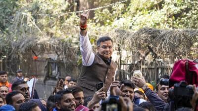 BJP candidate from New Delhi assembly constituency Parvesh Verma celebrates outside a counting centre after claiming victory in the Delhi Assembly polls on Saturday. (PTI) BJP candidate from New Delhi assembly constituency Parvesh Verma celebrates outside a counting centre after claiming victory in the Delhi Assembly polls on Saturday. (PTI)