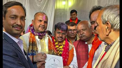 BJP’s Chandrabhan Paswan receives the winning certificate after the Milkipur bypoll result, in Ayodhya, Saturday. (PTI Photo) BJP’s Chandrabhan Paswan receives the winning certificate after the Milkipur bypoll result, in Ayodhya, Saturday. (PTI Photo)