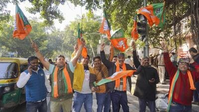 BJP supporters celebrate after early trends showed the party leading in the Delhi assembly poll results on Saturday. (PTI Photo) BJP supporters celebrate after early trends showed the party leading in the Delhi assembly poll results on Saturday. (PTI Photo)