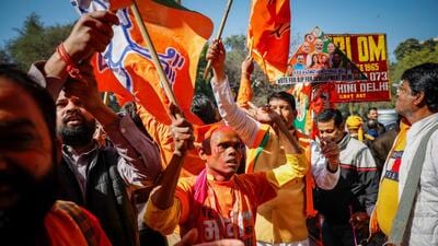 BJP supporters celebrate outside the Delhi BJP headquarters. (Reuters) BJP supporters celebrate outside the Delhi BJP headquarters. (Reuters)