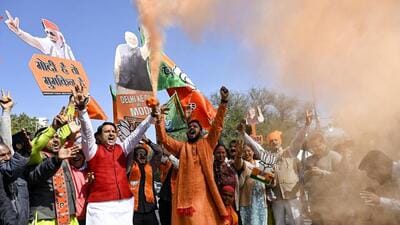 Bharatiya Janata Party supporters celebrating the BJP’s win in the Delhi assembly elections on Saturday. (ANI Photo)