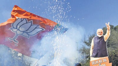 Bjp supporters celebrate the party's win in the Delhi Assembly elections at the party office in New Delhi on Saturday. (Sanjeev Verma/HT PHOTO) Bjp supporters celebrate the party's win in the Delhi Assembly elections at the party office in New Delhi on Saturday. (Sanjeev Verma/HT PHOTO)