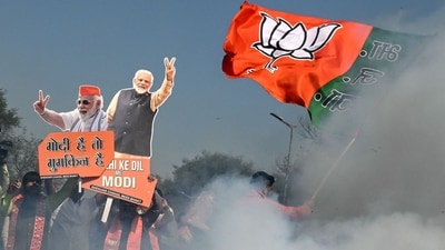 Supporters of the Bharatiya Janata Party celebrate as BJP leads in vote counting for the Delhi legislative assembly election outside the party's headquarters in New Delhi on February 8, 2025. (AFP) Supporters of the Bharatiya Janata Party celebrate as BJP leads in vote counting for the Delhi legislative assembly election outside the party's headquarters in New Delhi on February 8, 2025. (AFP)