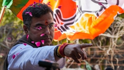 BJP candidate from New Delhi assembly constituency Parvesh Verma celebrates outside a counting center after claiming victory in the Delhi assembly polls amid the counting of votes in New Delhi. (PTI) BJP candidate from New Delhi assembly constituency Parvesh Verma celebrates outside a counting center after claiming victory in the Delhi assembly polls amid the counting of votes in New Delhi. (PTI)