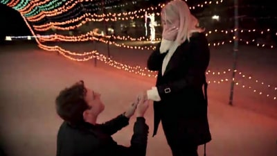 Daryl Sabara popped the question to Meghan Trainor on her 24th birthday, surprising her with a stunning proposal beneath a tunnel of twinkling Christmas lights, surrounded by family and friends. The sweet moment was captured on video. (@meghantrainor/Instagram)